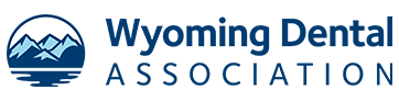 The image displays a logo with text that reads WYOMING DENTAL ASSOCIATION and features a stylized mountain range design, indicating an association related to dentistry in Wyoming.
